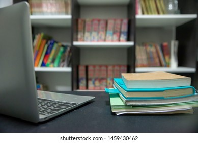 Laptop Computer For Study For Exam, Book Place On School Table For Student In Library. Wooden Desk With Desktop, Laptop, Notebook, Book And Diary, Work Online At Home. Desk For Student Concept