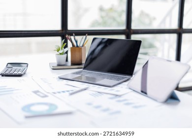 Laptop Computer, tablet report, notebook, Workspace Working Desk Accounting Analysis Concept

