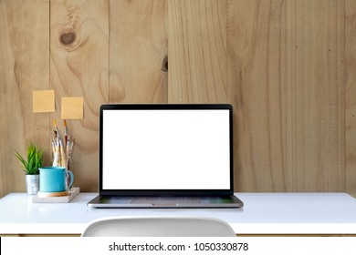 Laptop Computer White Blank Screen On Work Table Front View. Stylish Workspace With Desktop Computer. Mock Up Computer. 