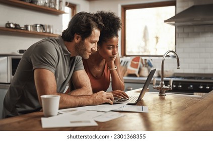 Laptop, couple and financial planning in a kitchen with documents for budget, savings and paying bills. Interracial, online and people with paperwork for taxes, mortgage and home loan application - Powered by Shutterstock