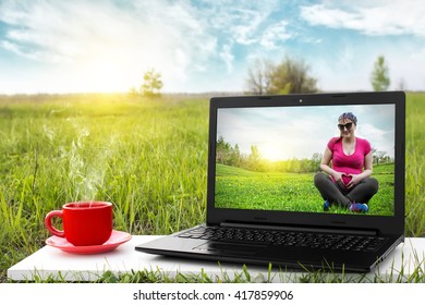 Laptop And Cup Of Hot Coffee On The Background Picturesque Nature, Outdoor Office. Travel Concept. Business Ideas. Choice Of Travel. The Concept Of Motherhood.