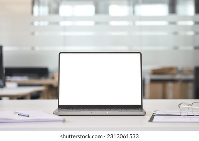 Laptop device mock up template design on office workplace desk, white mockup empty blank computer screen on office work table business web technology at modern workspace, closeup. - Shutterstock ID 2313061533