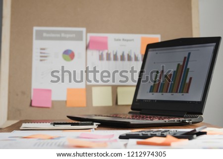 Laptop and document of account, calculated, financial reporting, with charts, graphs on the desk. The concept of business finance and accounting, Start up business