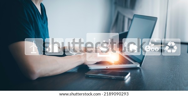 Laptop and eco with energy worker interface,\
sustainable development with renewable energy icon,conservation of\
natural resources Environmental protection,electric car,\
powerplant, energy\
transmission