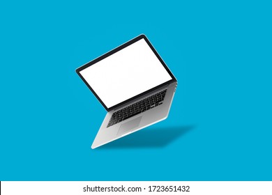 Laptop Floating In Front Of A Blue Background