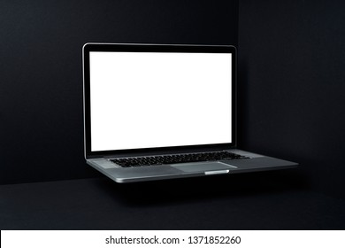 Laptop floating  with white blank screen on mockup three dimensional black background - Powered by Shutterstock