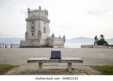 Laptop in front of the Belém tower