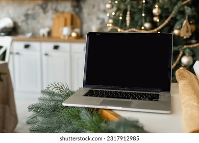 laptop with gift box and christmas lights background - Powered by Shutterstock