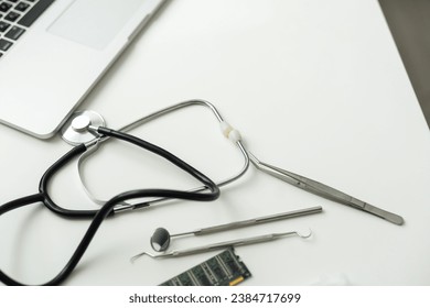 Laptop, glasses and stethoscope kept on doctor's table. - Powered by Shutterstock