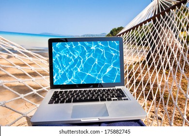 Laptop In Hammock On The Beach