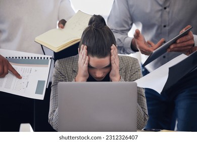 Laptop, headache and multitask with a business woman and demanding colleagues working in the office. Stress, anxiety and deadline pressure with an overwhelmed female employee at work on a computer