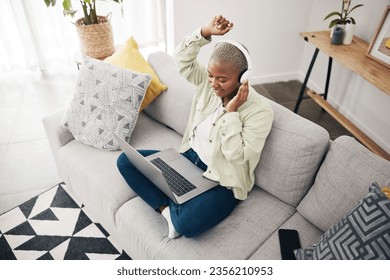 Laptop, home or woman in headphones dancing to music or streaming to relax with freedom. Top view, smile or happy African person listening to a radio song or audio on sofa on an online subscription