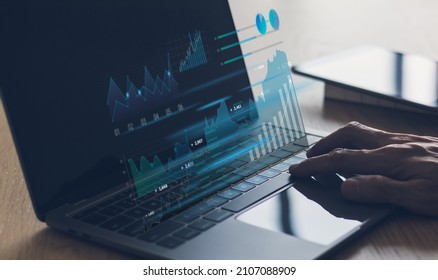 Laptop with information graph or data chart. Investor or trader trading with strategy planning or analysis in stock market or currency exchange. Financial and investment idea concept