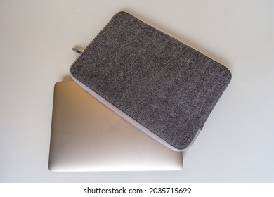 A Laptop Inserted Gray Computer Case With Open Zipper. White Background. Technology.