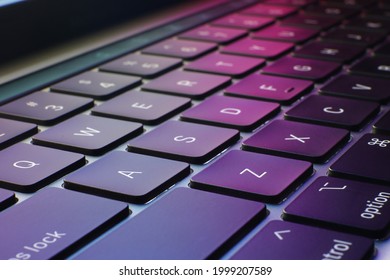 laptop keyboard with colorful background - Shutterstock ID 1999207589