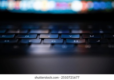 Laptop keyboard with high depth of field view reflections from glowing screen on letters. - Powered by Shutterstock