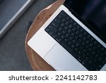 laptop keyboard on wooden table