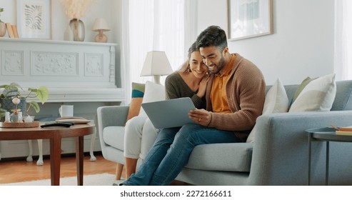 Laptop, living room and couple search website information for home investment, loan or real estate property discussion on sofa. Young people on couch with pc internet, planning future together - Powered by Shutterstock