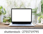 Laptop and matcha and notebook in front of window, cozy workspace