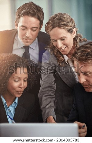 Laptop, meeting and problem solving with a business team planning in the workplace of a professional office. Teamwork, collaboration and computer with an employee group working together on a project