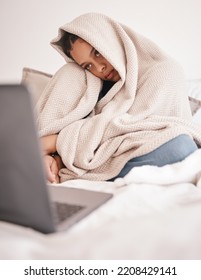 Laptop, Mental Health Problem And Insomnia Woman From Rome Feeling Sad On A Bed With Depression. Depressed Person With A Computer In A House Bedroom Blanket With Stress, Sick Or With Anxiety At Home