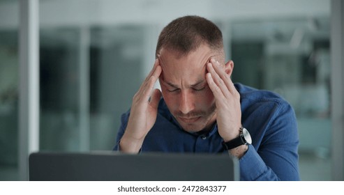 Laptop, migraine and man in office, night and tired of copywriting, hand and burnout for deadline. Computer, editing and employee working late, professional and fatigue with headache and project - Powered by Shutterstock