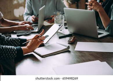 Laptop, Mobile Phone, Tablet And Documents On A Working Table In Creative Office. Successful Teamwork And Business Startup Concept.