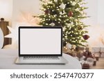 Laptop mockup with Christmas tree at background. Working from home, student lifestyle, distance education, online learning, study, meeting online, ordering gifts concepts