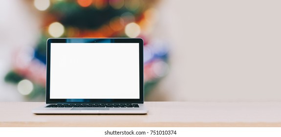 laptop mock-up on christmas bokeh background in office - Powered by Shutterstock