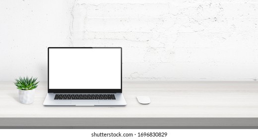 Laptop Mockup On Office Desk With Free Space Beside For Promo Text. Plant And Mouse Beside. White Brick Wall In Background. Scene Creator With Isolated Layers