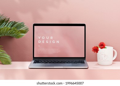 Laptop mockup with a pastel pink wall