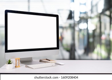 Laptop Monitor Digital Pc Desk Mockup Blank Screen Computer Desktop With Keyboard In Cafe & Restaurant Or Co-working Background.