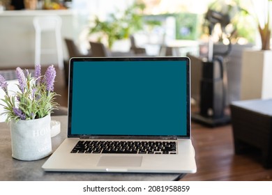 Laptop With News Website In Screen On Table In Business Office, Corporate Lounge Or Hotel Lobby. Company Wireless Wifi. Modern Cafe Or Workplace. Online Article In Computer. Woman On Chair Waiting