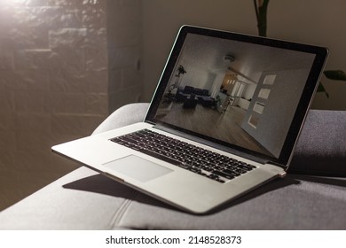 Laptop With News Website In Screen On Table In Business Office, Corporate Lounge Or Hotel Lobby. Company Wireless Wifi. Modern Cafe Or Workplace. Online Article In Computer. Woman On Chair Waiting..