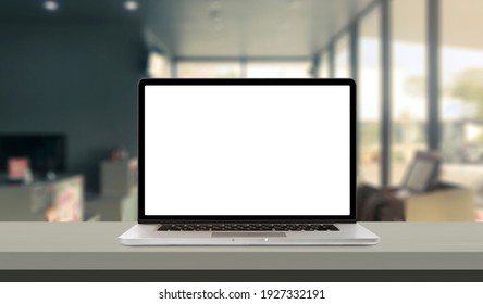 Laptop or notebook with blank screen on service counter in blurry background with parcel delivery office express, EMS. - Shutterstock ID 1927332191