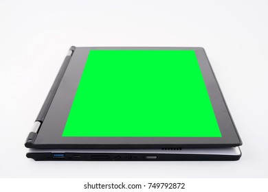 Laptop or notebook computer with a chroma key green screen or display on a isolated background
