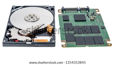 A laptop notebook spinning harddrive and SSD harddrive on an isolated background