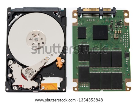 A laptop notebook spinning harddrive and SSD harddrive on an isolated background