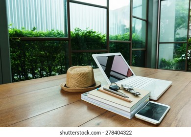 laptop, notebook and work accessory on wood table