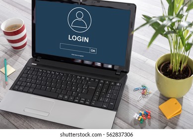 Laptop On A Desk With Login Concept On The Screen