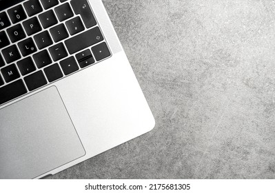 Laptop on grey stone background. Office workspace flat lay - Shutterstock ID 2175681305