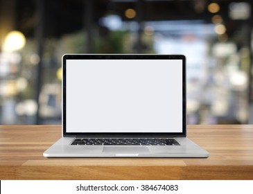 Laptop On Table Against Bokeh Lights Background,blank Screen