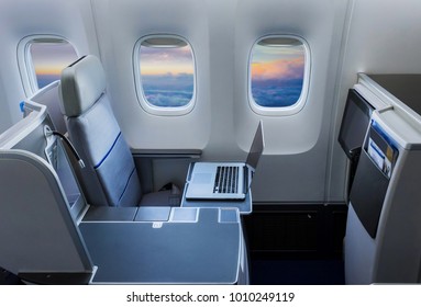 Laptop On The Table Of Airplane Seat