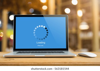 Laptop on table with loading bar load waiting on digital display,  indicator concept.