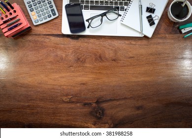 Laptop On Vintage Wooden Desktop In Modern Office With Accessories - Top View On Desk From Above.