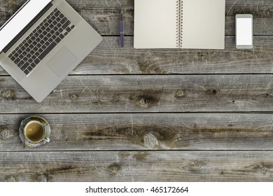 Laptop On Vintage Wooden Desktop In Modern Office With Accessories - Top View On Desk From Above.
