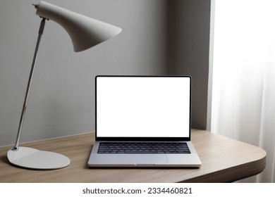 laptop on a wooden table on a black background, workplace - Powered by Shutterstock