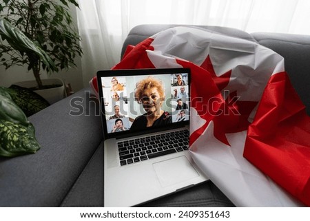 laptop with online chat and Canadian flag