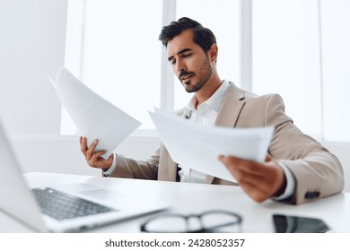 Laptop paper holding planning businessman office