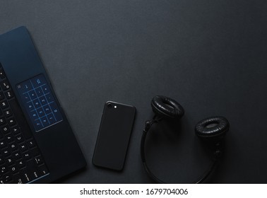 Laptop, phone,  watch,  sunglasses over monochrome black  background. Work accessories of a blogger with copy space and top view.
Minimalist black  trendy, Flat Lay - Powered by Shutterstock